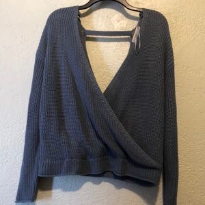 Blue knitted sweatshirt with a v cut on both back and front